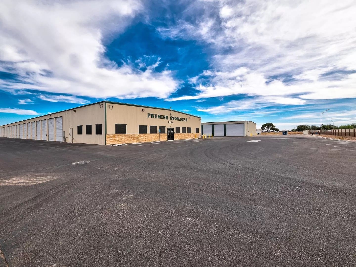 Wide driveways between rows of large storage units
