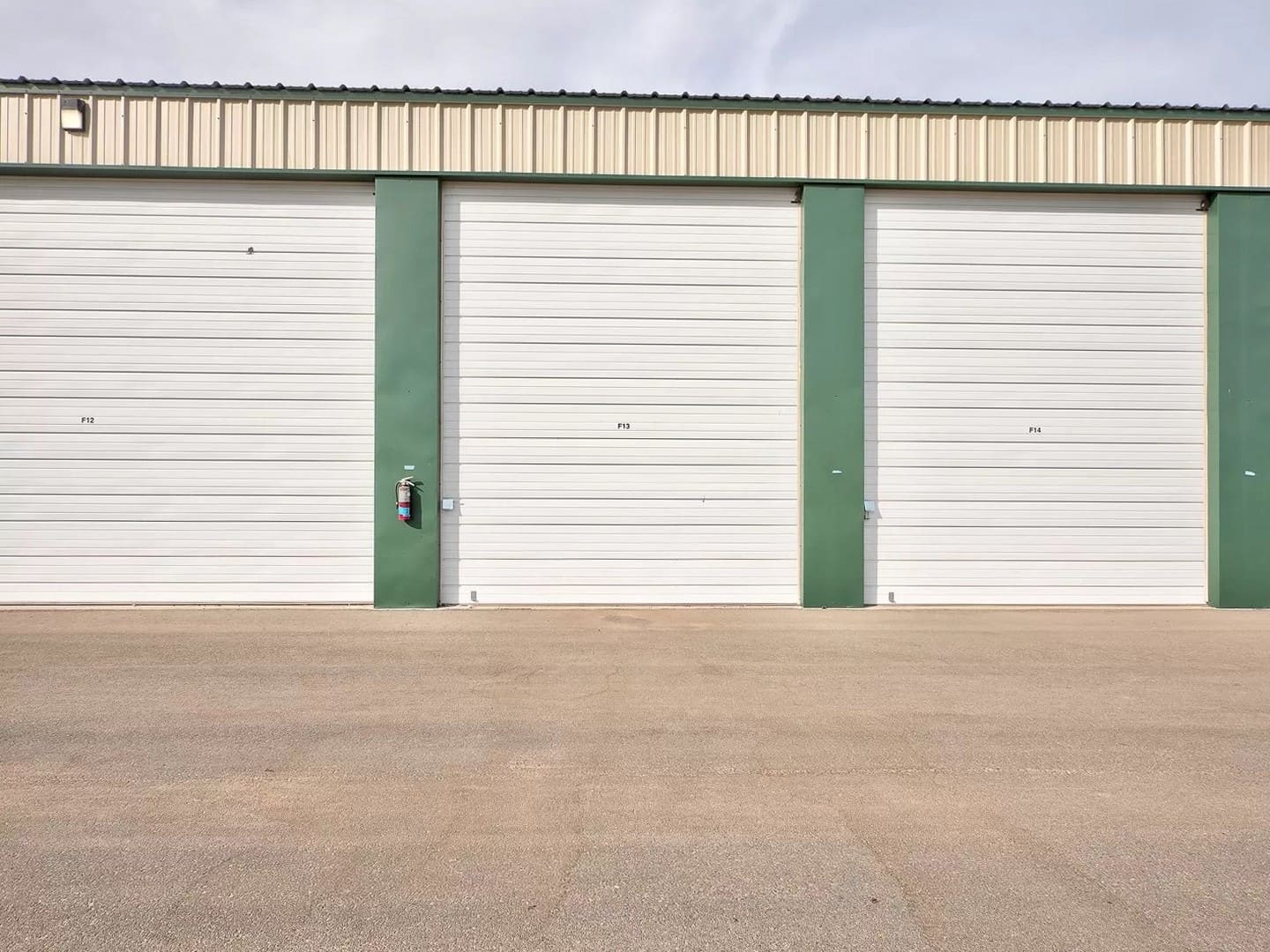 A row of drive-up storage units with 14-foot-tall doors