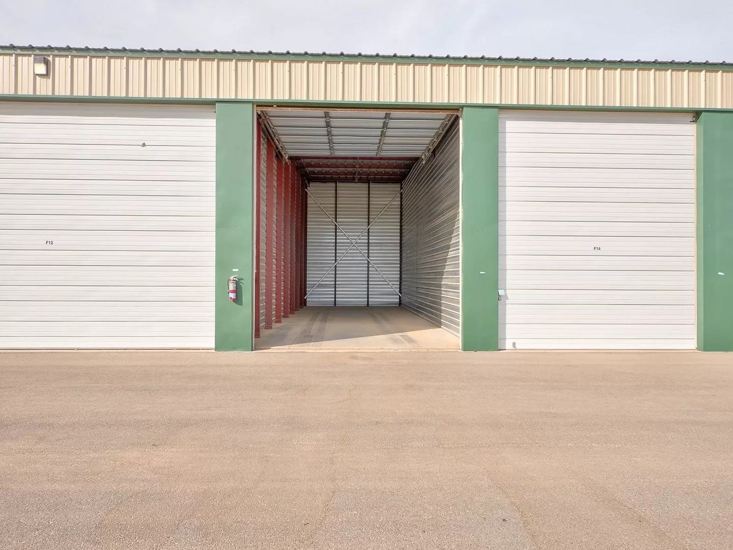 A drive-up storage unit with its 14-foot-tall door open